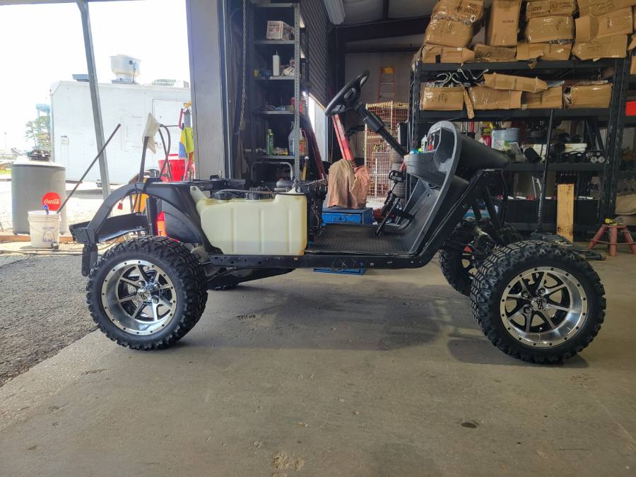 Custom golf cart with upgraded wheels and lift kit